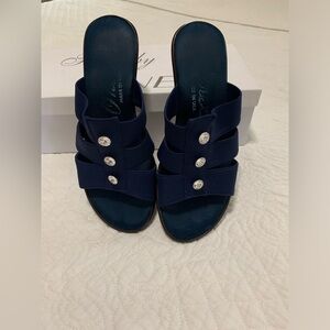 Onex brand navy sandals with rhinestones.